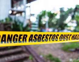 Image of danger asbestos dust hazard tape at a work site